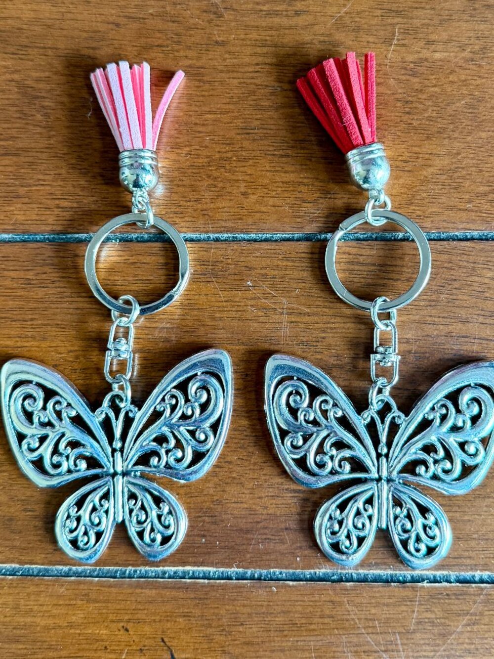 NEW 2-Pc Silvery Hollow Butterfly Keychain with Pink Tassel & Red Tassel Charm